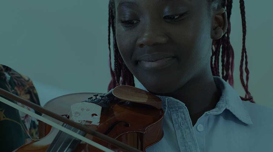 A young African-American woman playing the violin