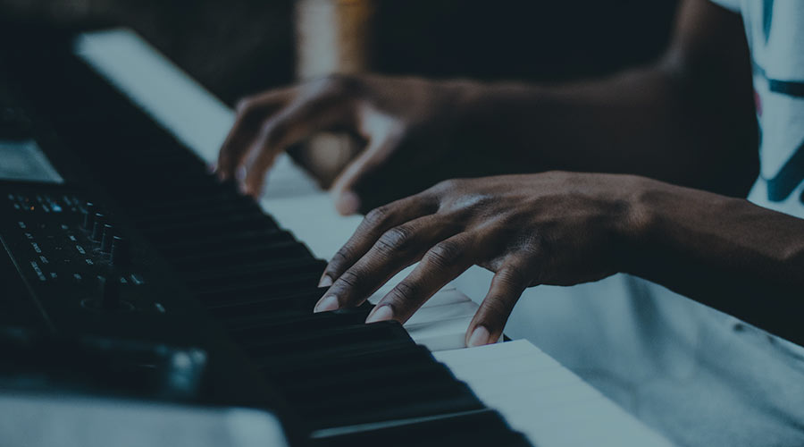 A pair of hands playing the piano