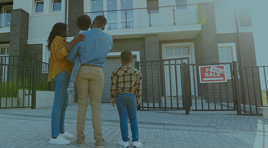 African American family looks at their new home.