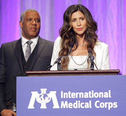 Hope Dworaczyk Smith stands with Robert F. Smith at an International Medical Corps Gala in 2018
