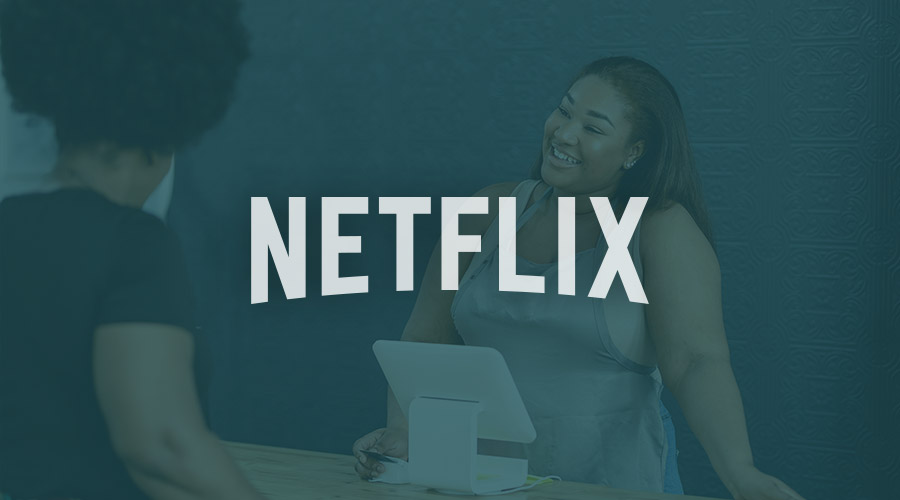 A Netflix logo is superimposed on the image of a Black business owner
