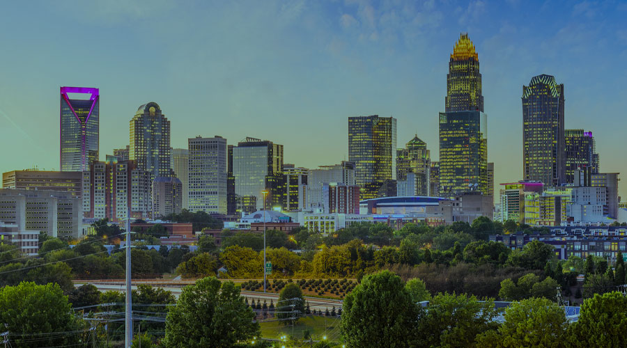 A photo of tall buildings and parks in Charlotte, North Carolina’s downtown area.