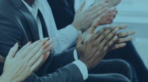 An up close photo of hands clapping.