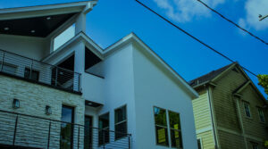 Image of two homes right next to each other under a blue sky