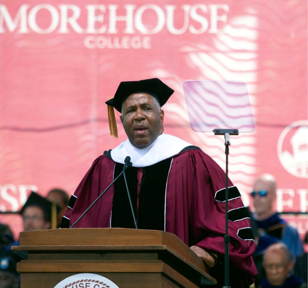Robert F. Smith wears a cap and gown as he delivers the graduation speach for the 2019 Morehouse College graduates